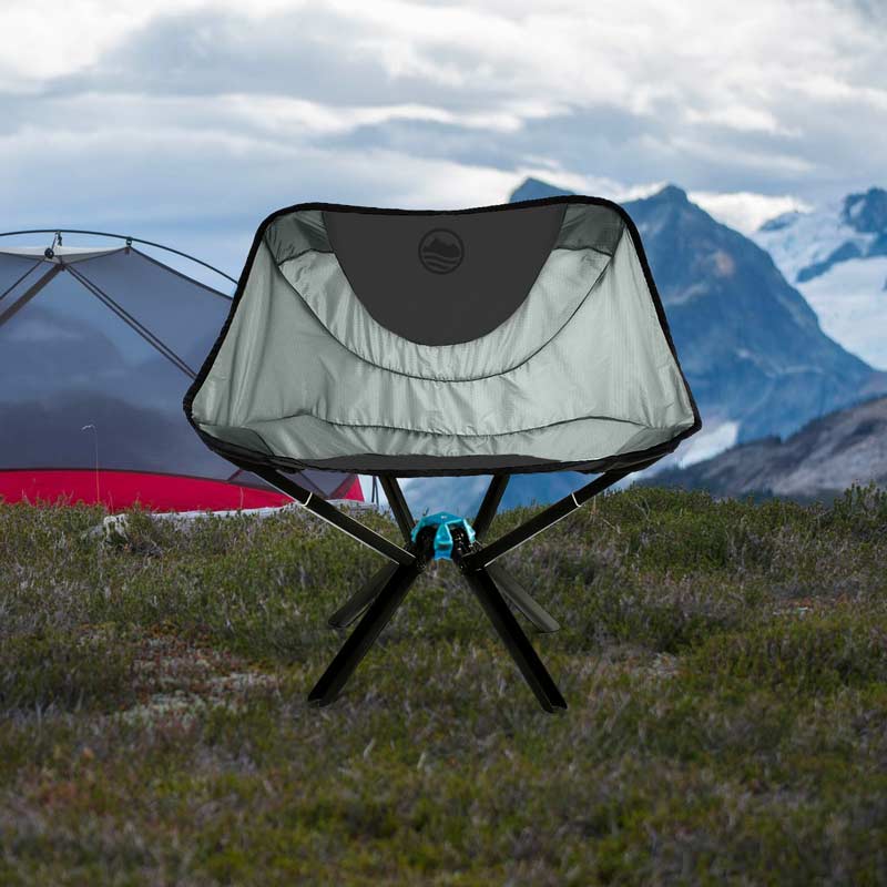 Cliq chair at a campsite high in the mountains with tent in the background