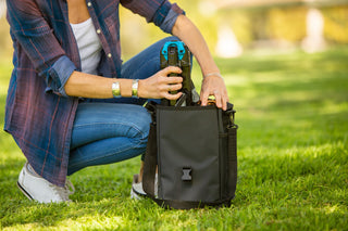 Women placing Cliq chair in bag