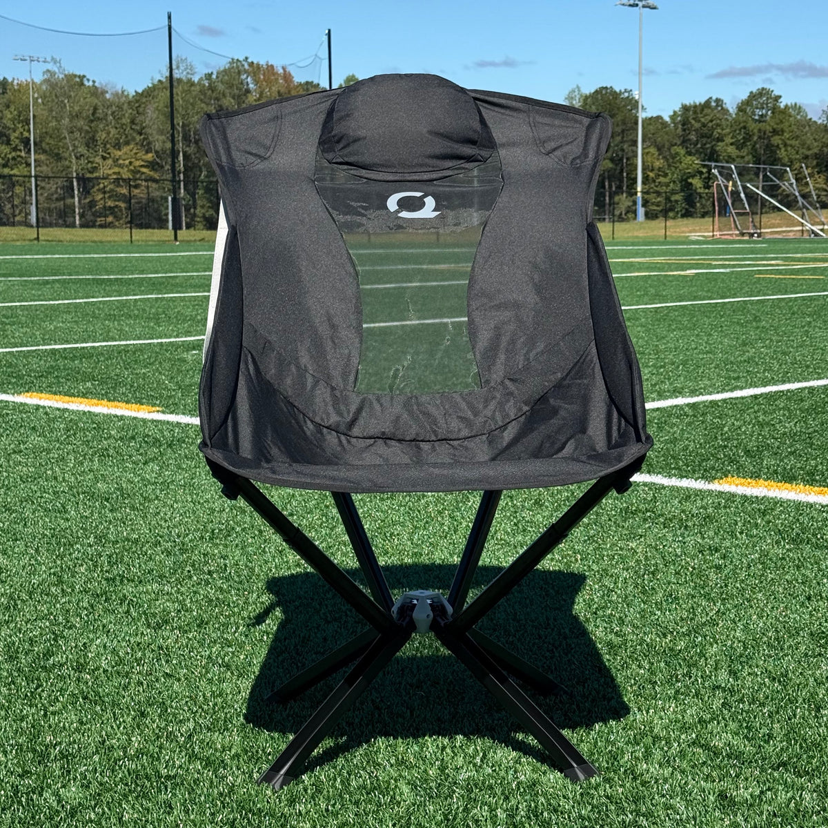Black EpiQ portable chair on soccer field
 - CLIQ Chairs