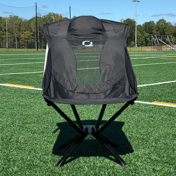 Black EpiQ portable chair on soccer field
 - CLIQ Chairs