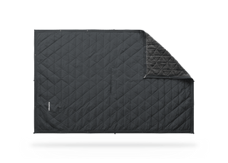 Kammok Mountain Blanket in Granite Gray, laid flat with a corner folded to show the fleece lining