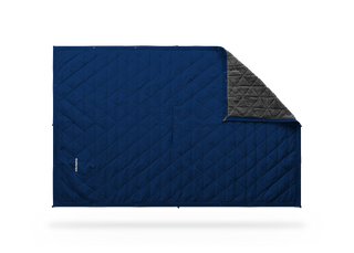 Kammok Mountain Blanket in Midnight Blue, laid flat with a corner folded