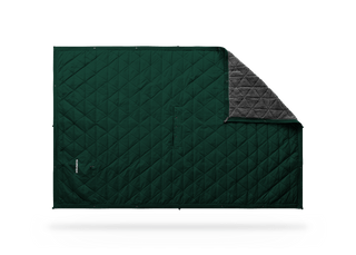 Kammok Mountain Blanket in Pine Green, laid flat with a corner folded