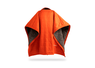 Kammok Mountain Blanket in Ember Orange worn as a poncho